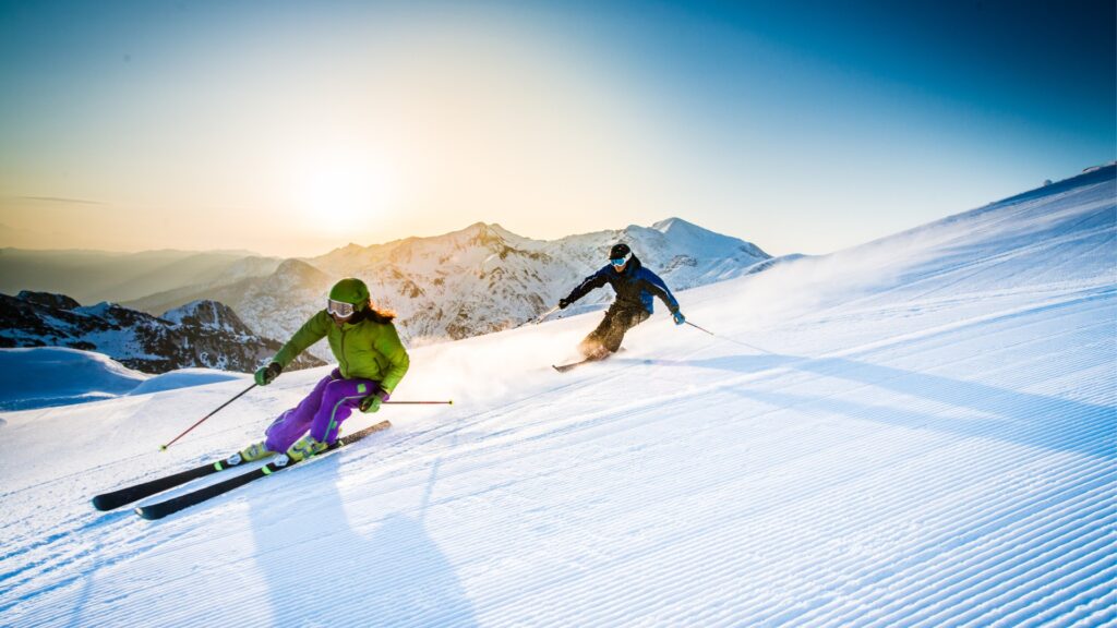 man and woman skiing downhill picture id484707884